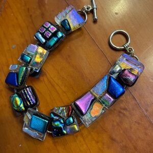 Bracelet: Dichroic glass 8" Each 1/2" black square is unique,infused with metal.
